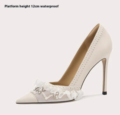 Beige high-heeled shoe with lace details on a white background