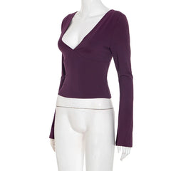 Purple long-sleeve top on a mannequin against a white background