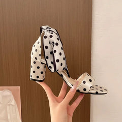 White polka-dot heel with a bow detail