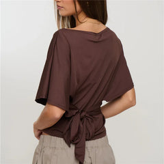 Back view of chocolate off shoulder boat neck crop top