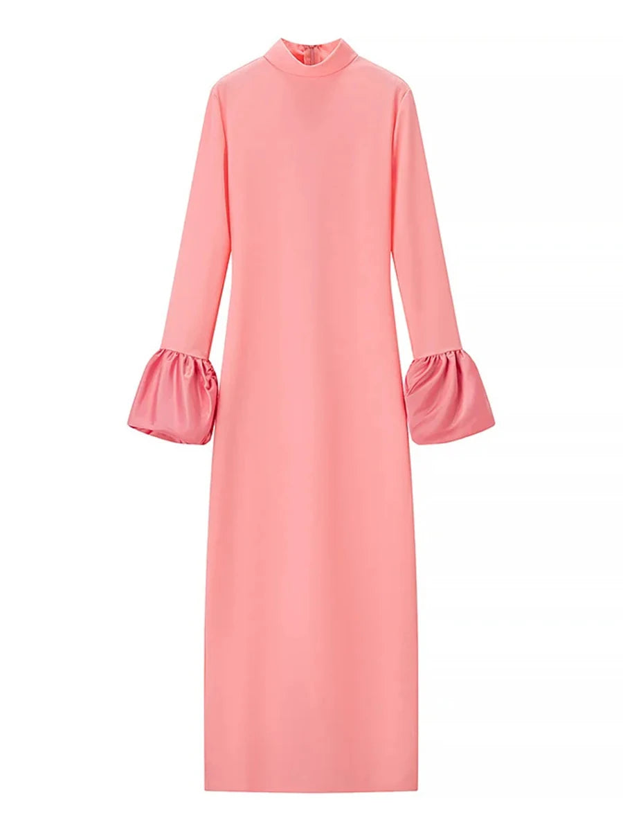 Pink dress with ruffled sleeves on a white background
