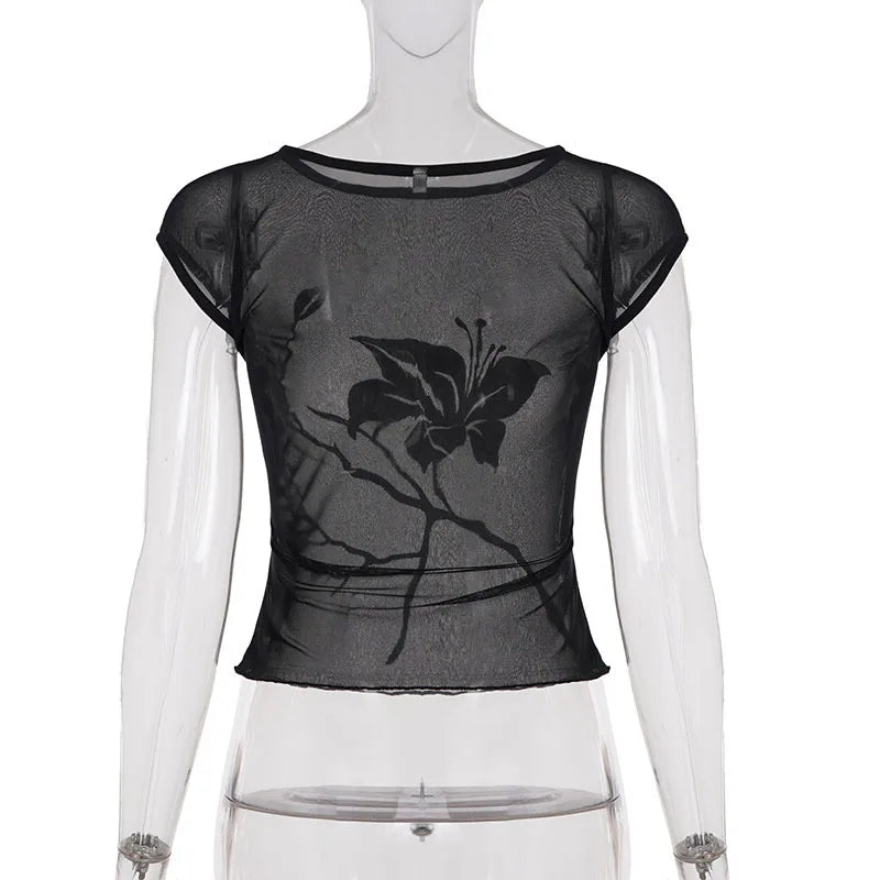 Black floral top on a mannequin against a white background