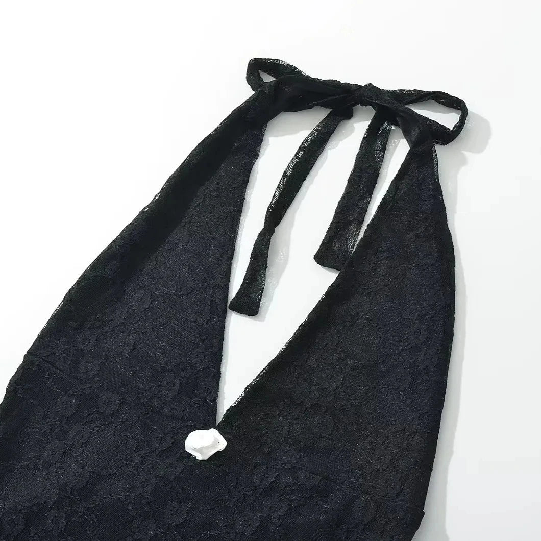 Black lace halter top on a white background