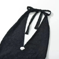 Black lace halter top on a white background