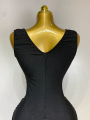 Black dress on a mannequin against a white background