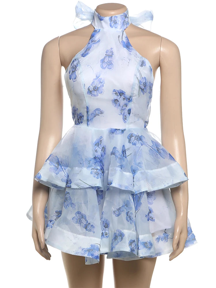 Mannequin wearing a blue floral dress on a white background