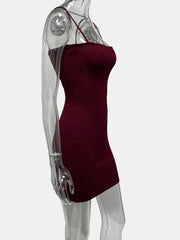 Red ribbed dress on a transparent mannequin against a white background