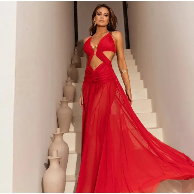 Woman in a red evening gown standing on a staircase