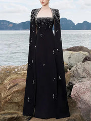 Black maxi dress with beaded cape sleeves