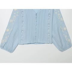 Front detail of Embroidered V-Neck Pleated Blouse sleeves
