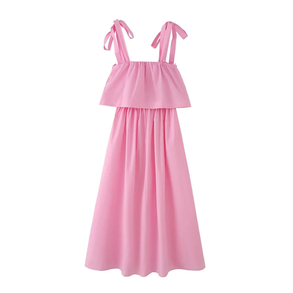 Close-up of pink bow tie strap midi dress shoulder detail