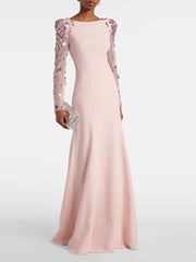 Pink evening gown with floral sleeves on a white background