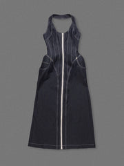 Black dress with a zipper on a gray background