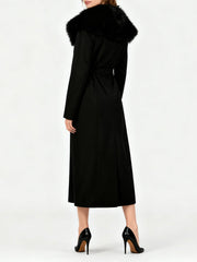 Black coat with fur collar on a white background