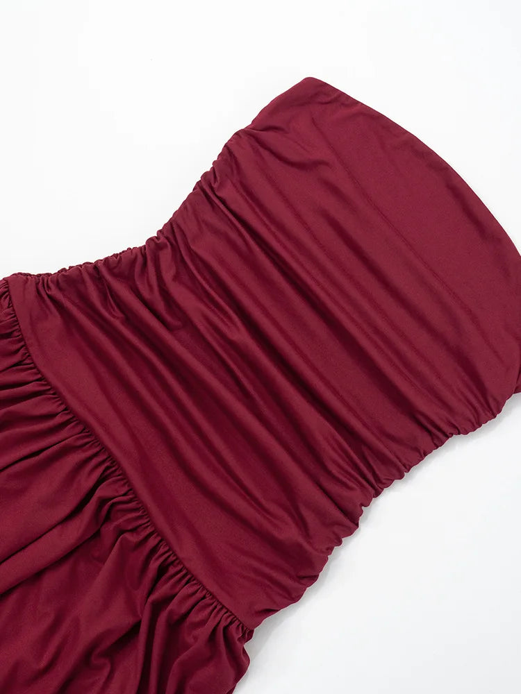 Maroon strapless top on a white background