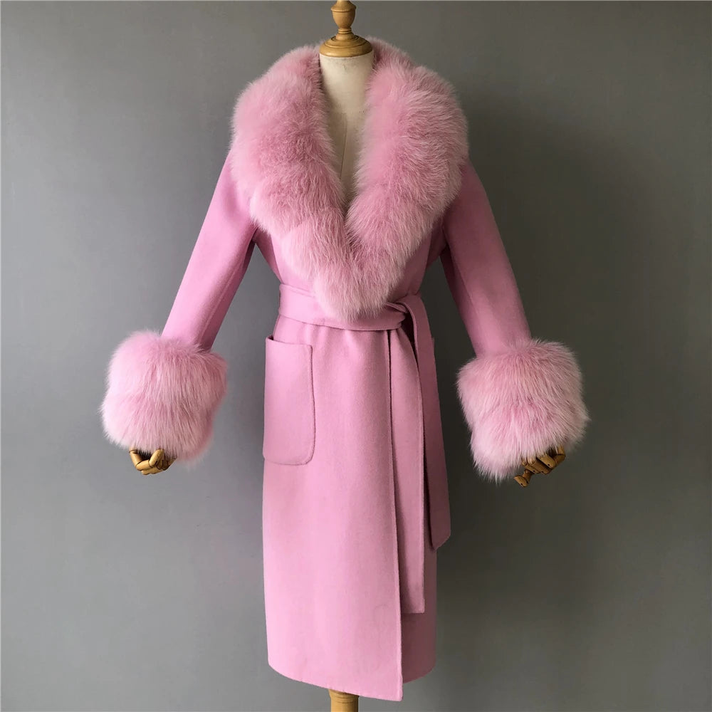 Pink coat with fur trim on a mannequin against a gray background