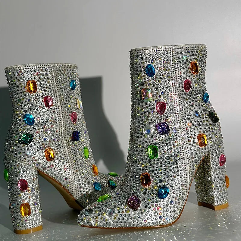 Side view of rhinestone embellished ankle boots with a zipper closure and block heel