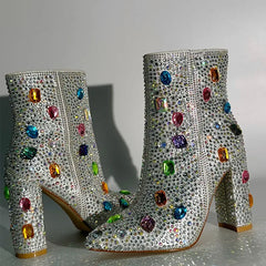 Side view of rhinestone embellished ankle boots with a zipper closure and block heel