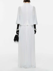 Back view of white chiffon maxi dress with cape sleeves