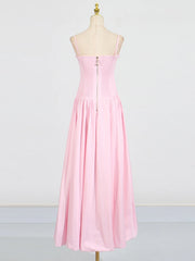 Pink strapless dress on a mannequin against a white background