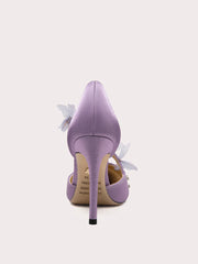 Purple high-heeled shoe with floral details on a white background
