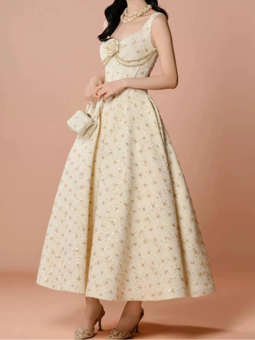 Cream scoop neck ankle dress with empire waist and floral appliqué detail
