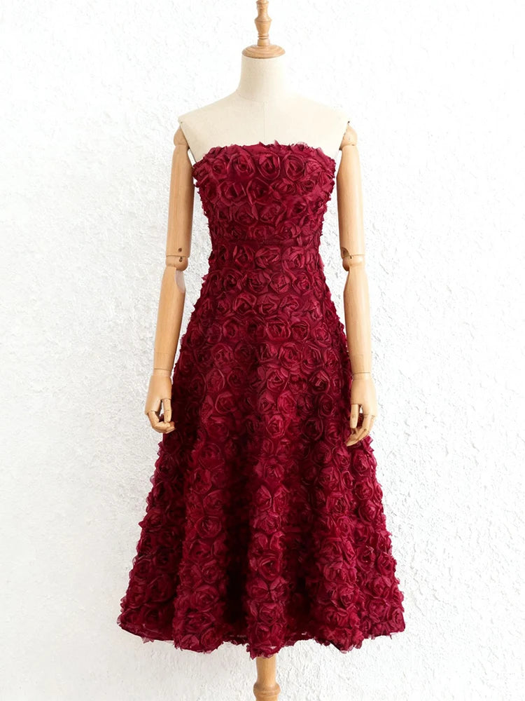 Elegant 3D floral burgundy gown styled for evening events