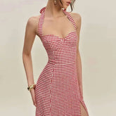 Red and white checkered dress worn by a model on a plain background