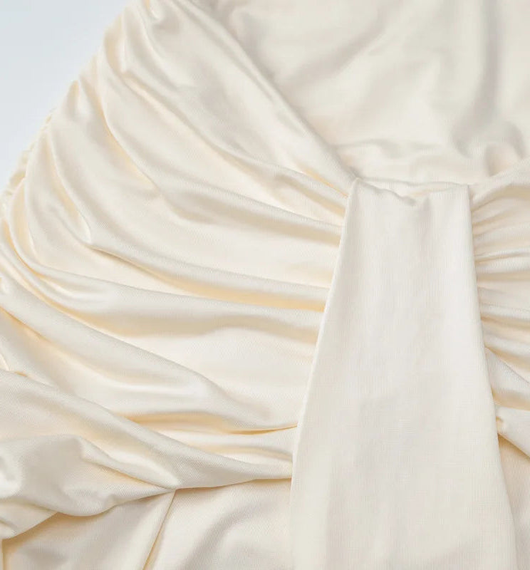 Close-up of a white fabric with gold accents