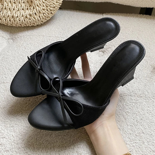 Black bow wedge mule