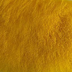 Close-up of a textured yellow surface