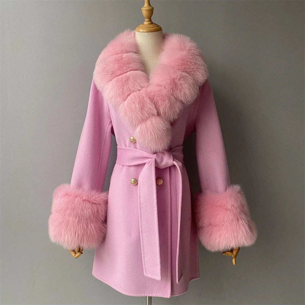 Pink coat with fur trim on a mannequin against a gray background