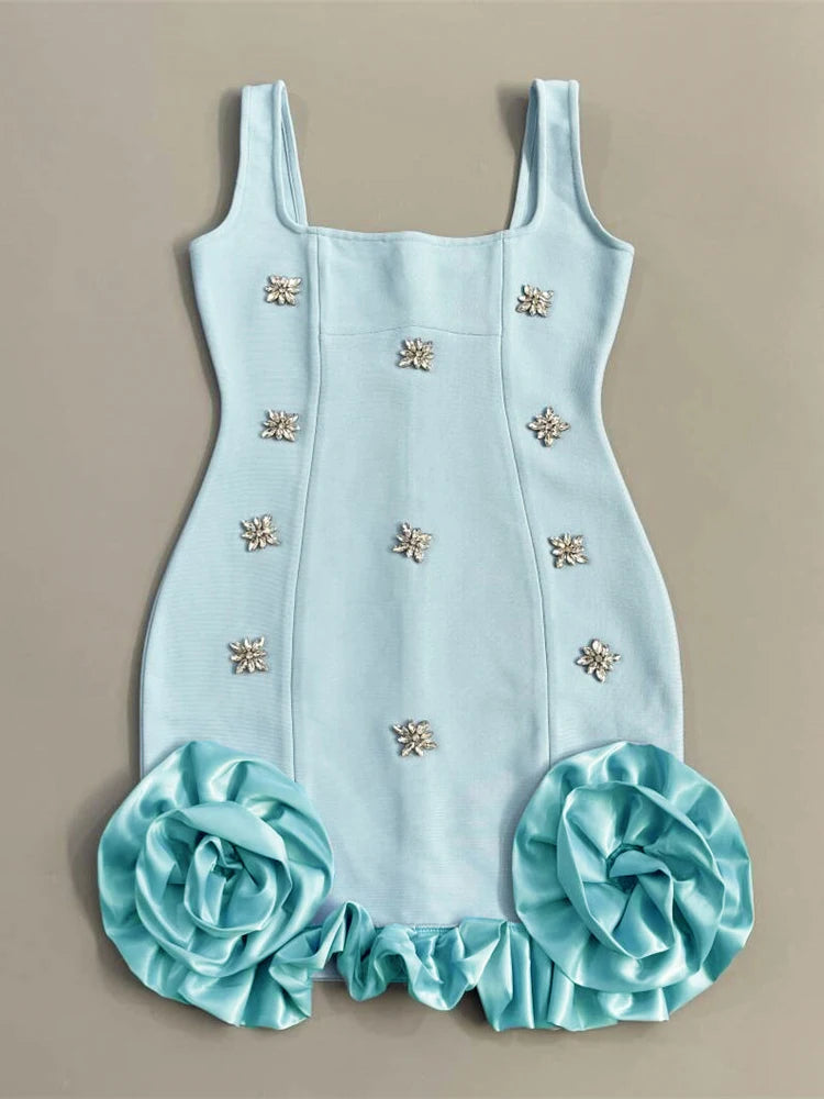 Light blue dress with floral embellishments on a beige background