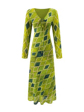V-neck tie-front long sleeve midi dress with diamond pattern, front view.