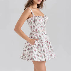 Woman wearing a floral dress on a gray background