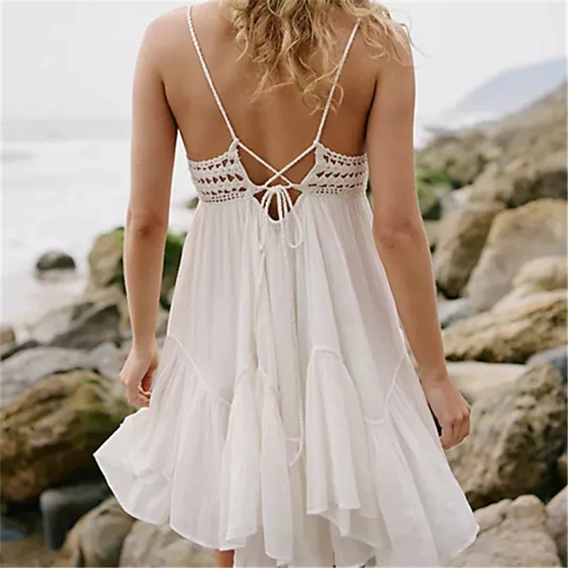 Back view of white crochet lace mini dress with tie detail