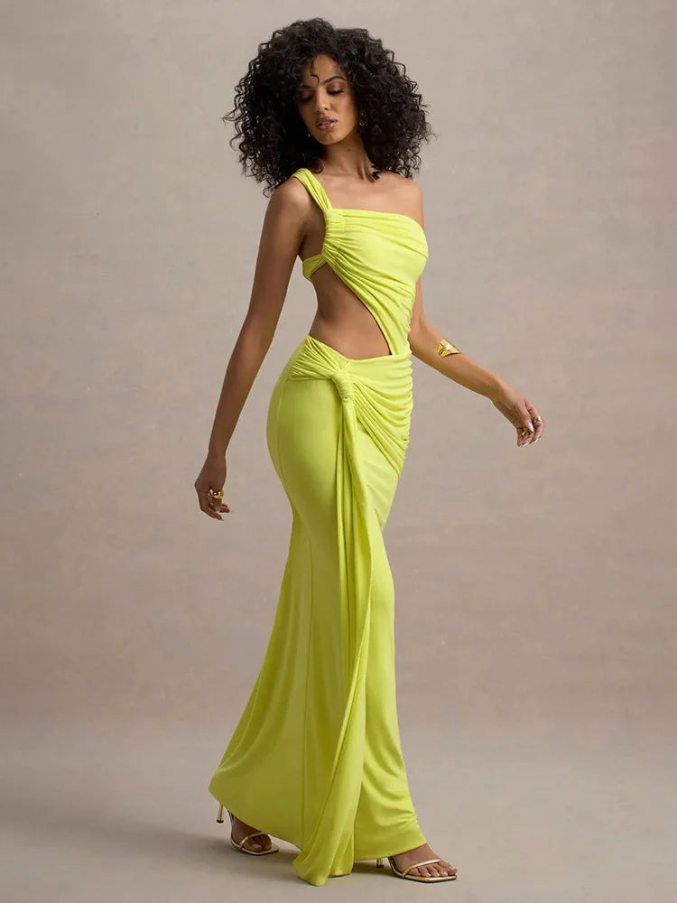 Woman wearing a bright yellow evening gown against a neutral background