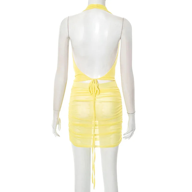 Yellow dress on a mannequin against a white background