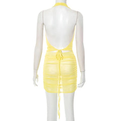 Yellow dress on a mannequin against a white background