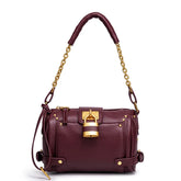 Burgundy leather shoulder bag with gold padlock closure and chain strap.