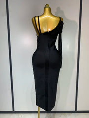 A black jumpsuit on a mannequin against a white background