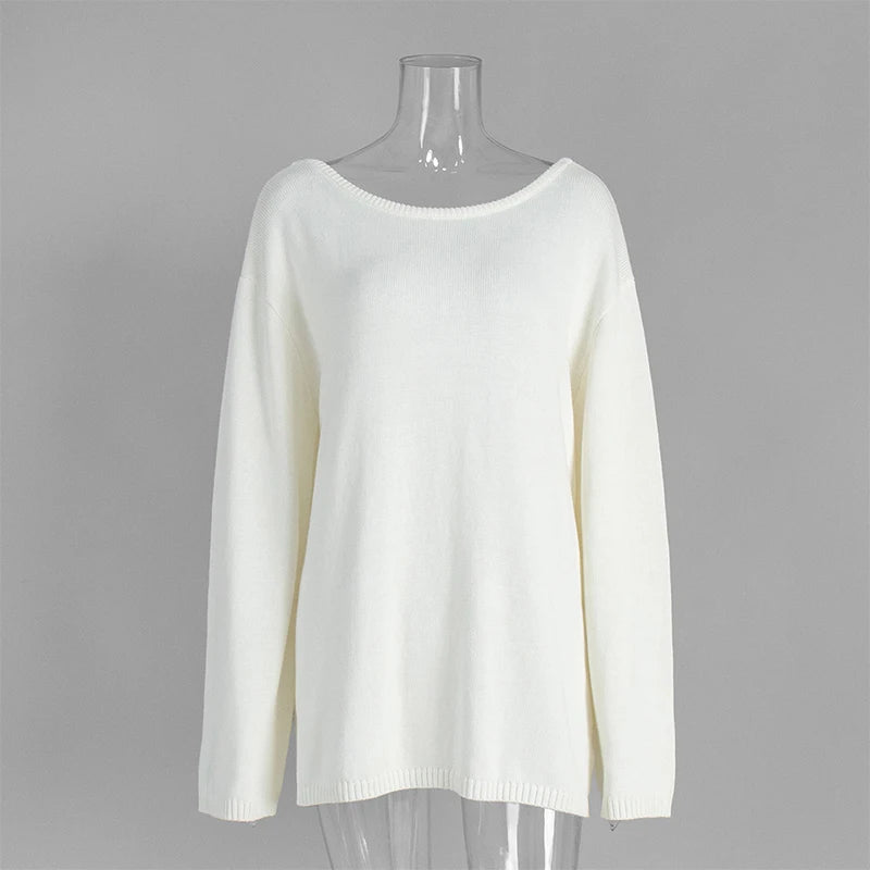 White sweater on a mannequin against a gray background