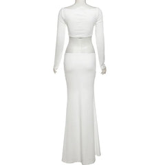 White long-sleeve gown on a mannequin against a white background
