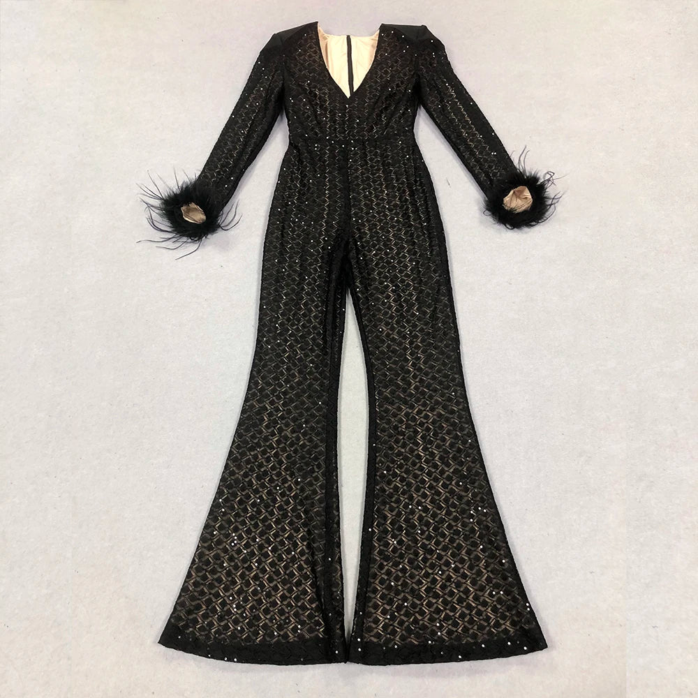 Black beaded jumpsuit with feathered cuffs on a light gray background