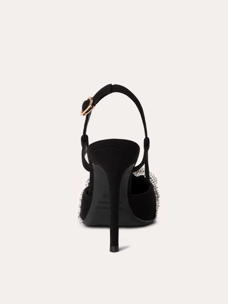 Black high-heeled shoe with a strap on a white background