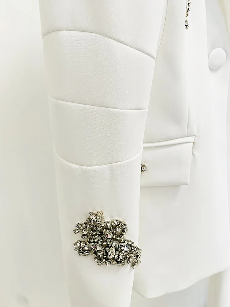 Close-up of a white coat with a decorative brooch
