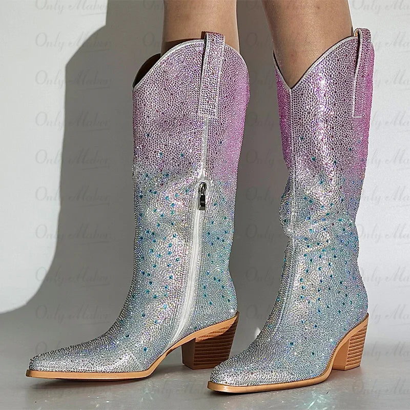 Sparkly silver and pink cowboy boots on a neutral background