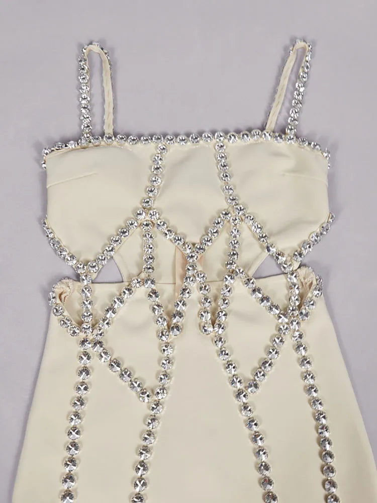 White dress with silver chain detailing on a gray background