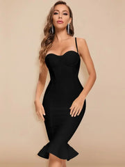 Woman wearing a black dress against a beige background