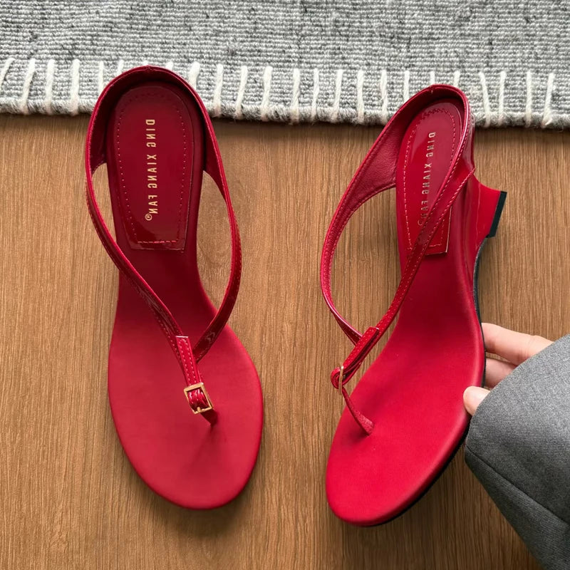 Red buckle strap wedge heel flip flops